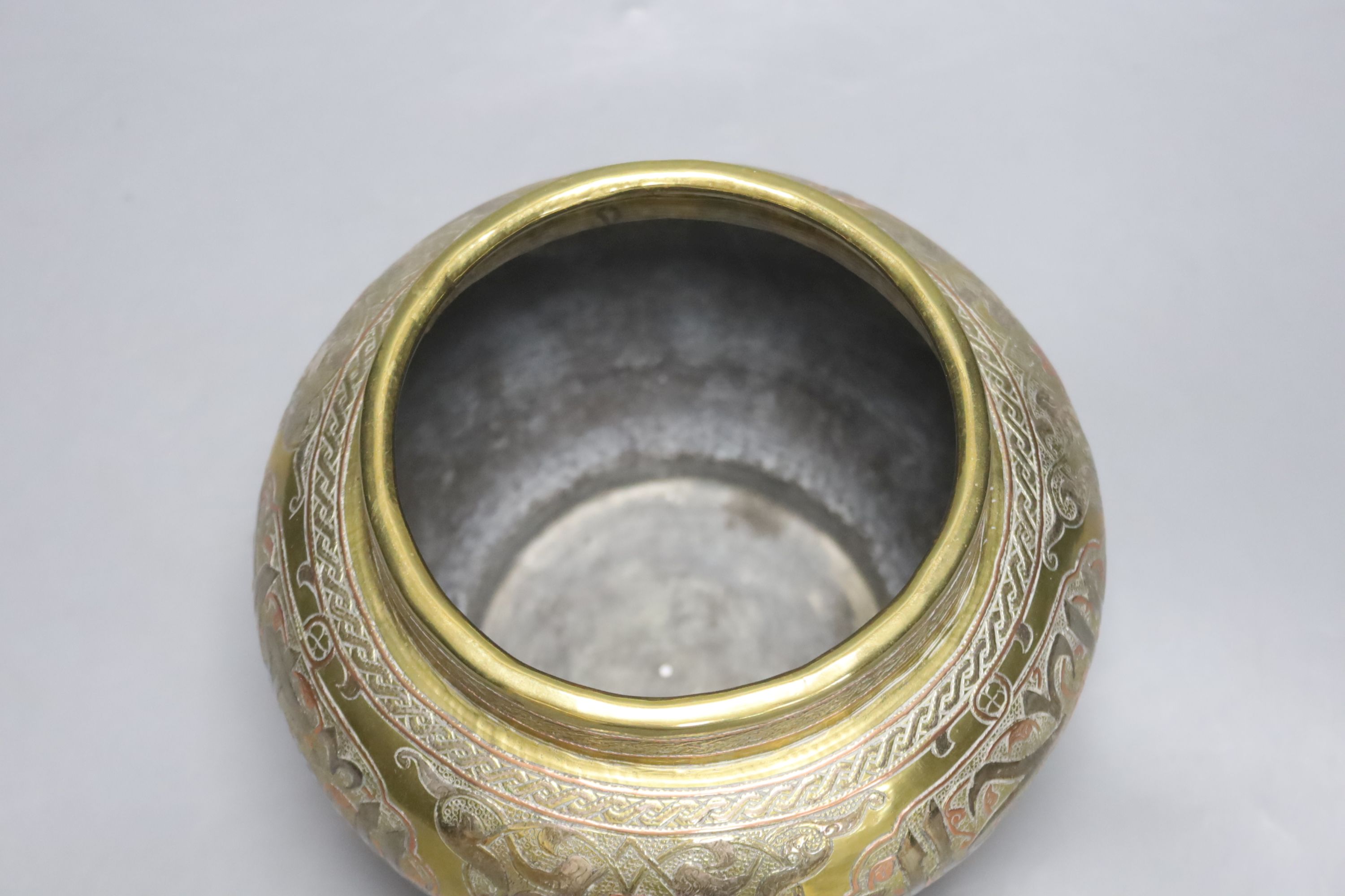 A Cairo ware brass multi-metal inlaid jardiniere, height 13cm